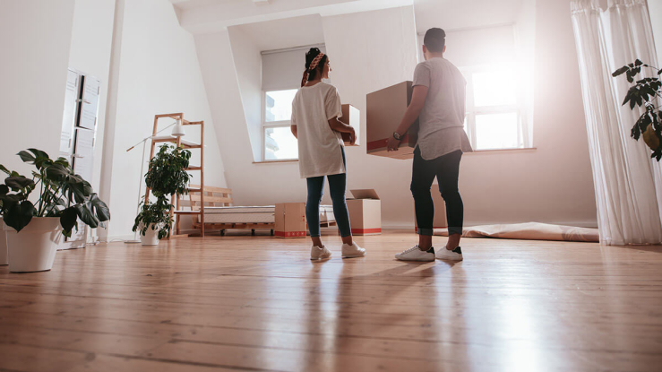 Couple moving into new home.