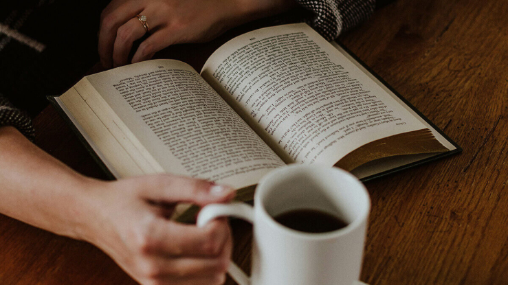 Person reading a book.