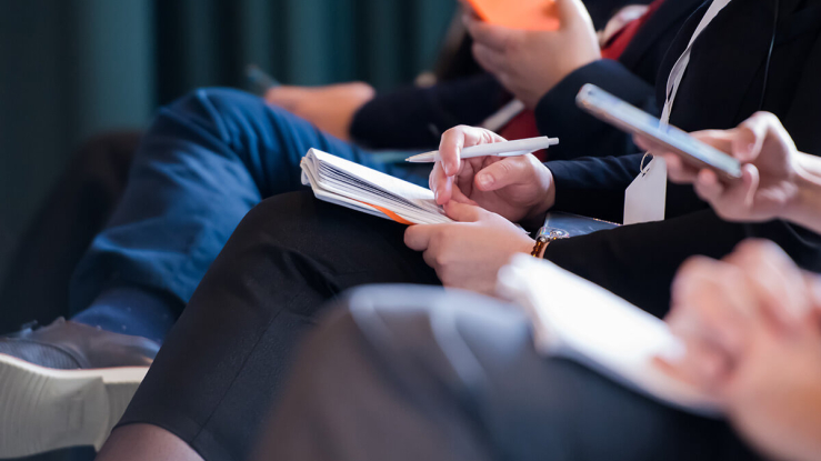 People taking notes.