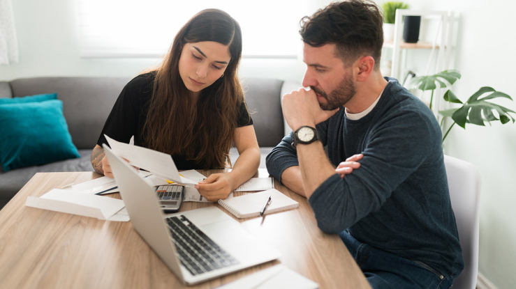 Couple looking at bills.