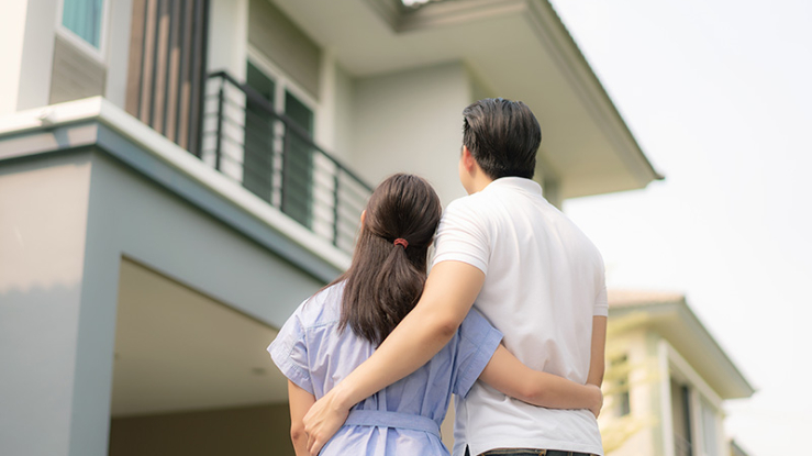 Couple looking at a home for sale.