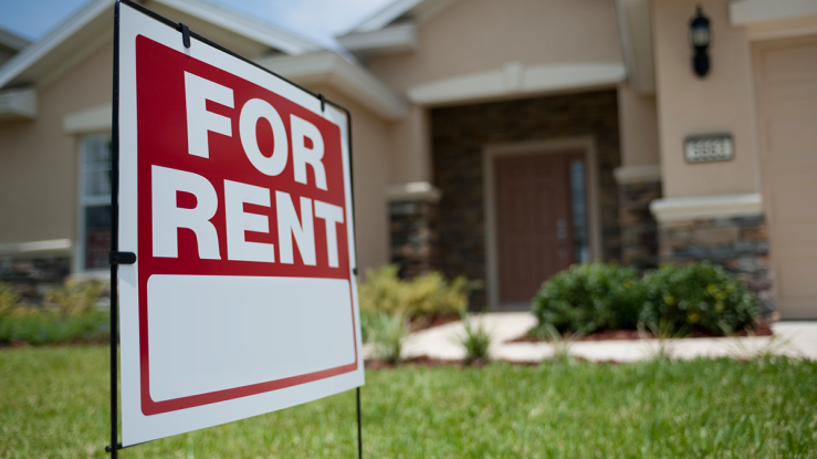 For Rent sign in front of a house.