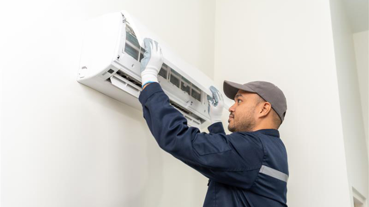 Technician working on a heat pump