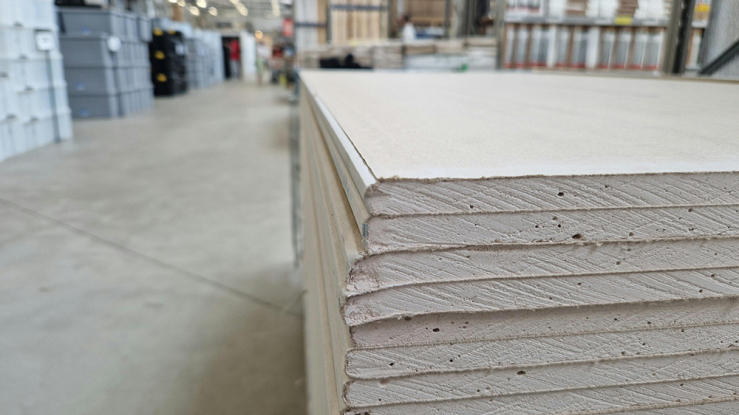 A stack of drywall in a home improvement store