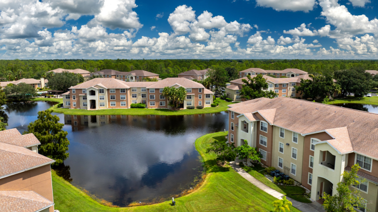 Apartment buildings next to a body of water.
