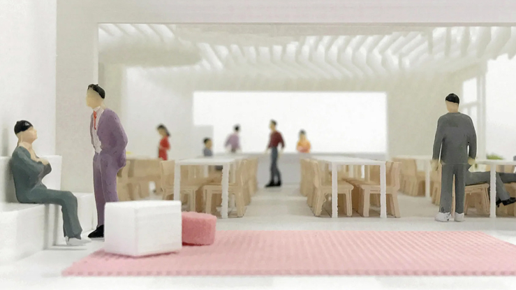 Models showing people interacting in a modern space.