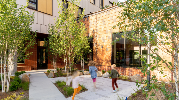 Children playing in the courtyard of a multifamily building.
