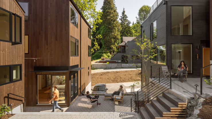 Attached modern homes surround a shared courtyard.