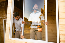 Contractors installing a new window