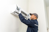 Technician working on a heat pump