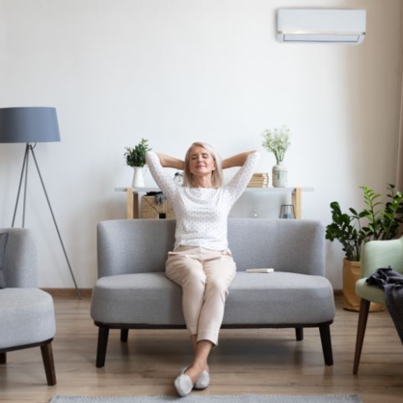 Woman sitting in living room