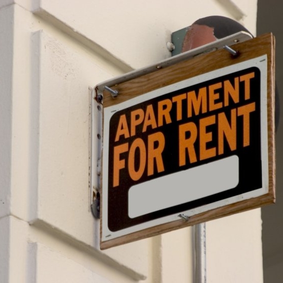 Apartment for rent sign.