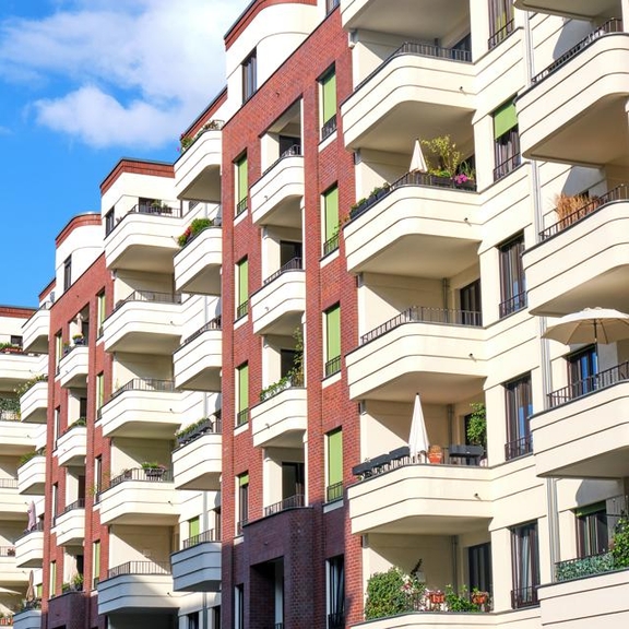 Multifamily apartment building with balconies.