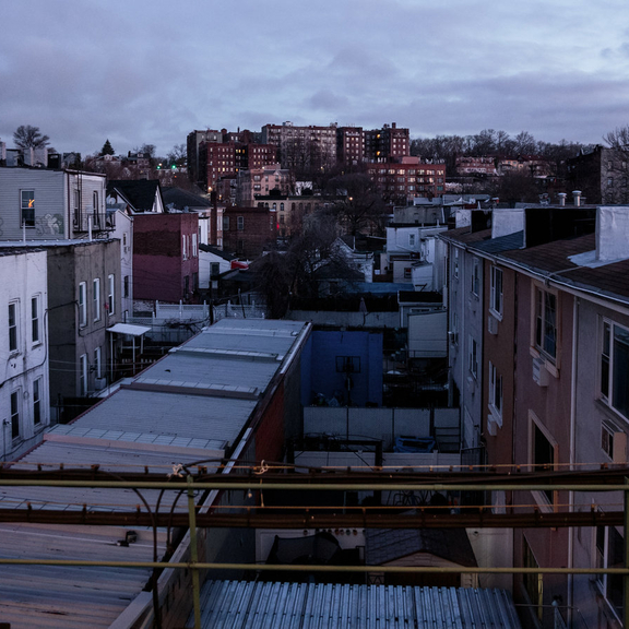 Rows of apartment housing on a stormy day.