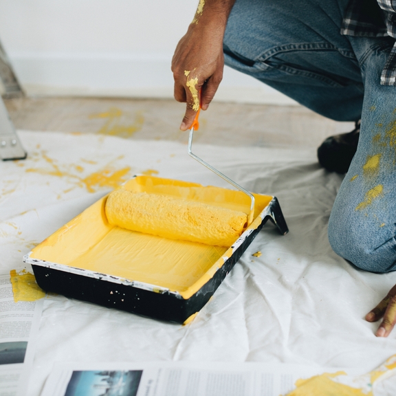 Man using a paint roller