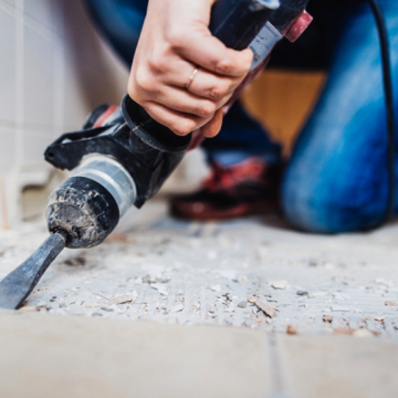 Man removing tile