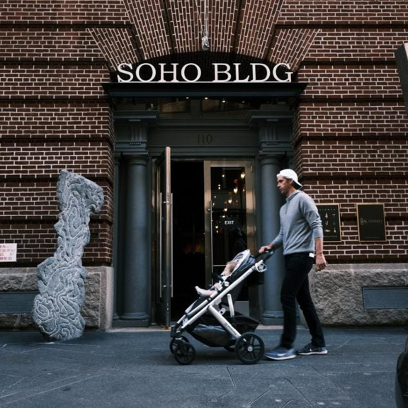 People walking on the street in Soho, New York.