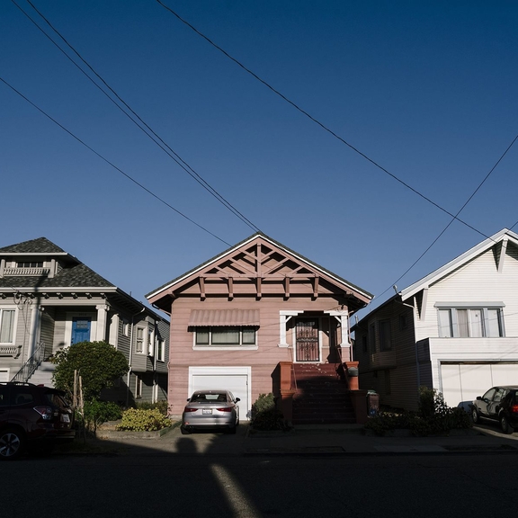 Row of small homes on a residential street.