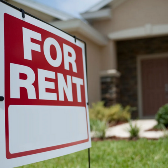 House with "for rent" sign.