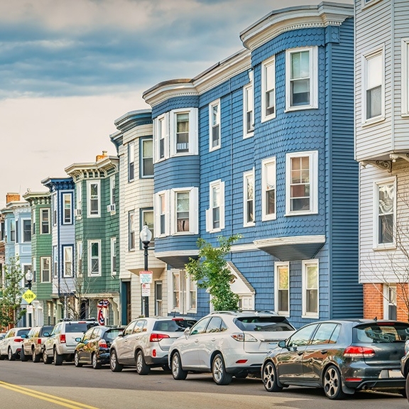 View of triple-decker apartment buildings.