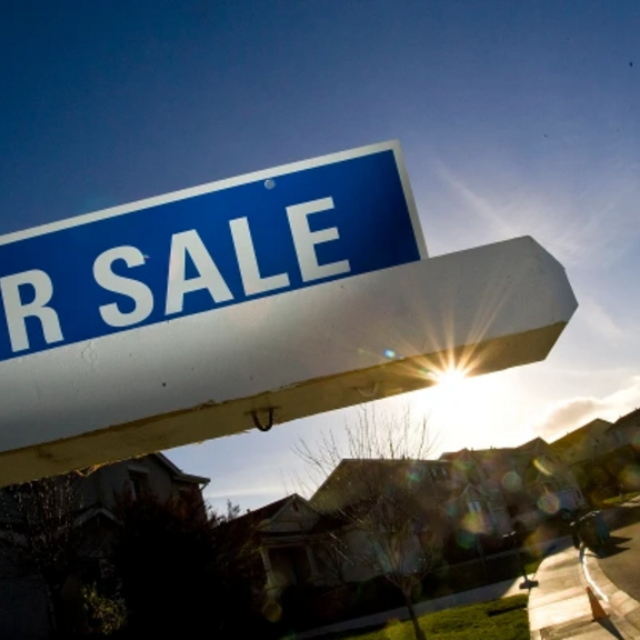 For-sale sign in neighborhood.