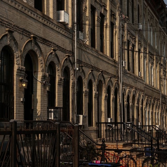 A row of residential houses stands in Brooklyn's neighborhood of Bushwick, New York, US.