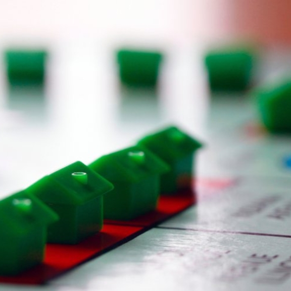 View of green Monopoly houses.