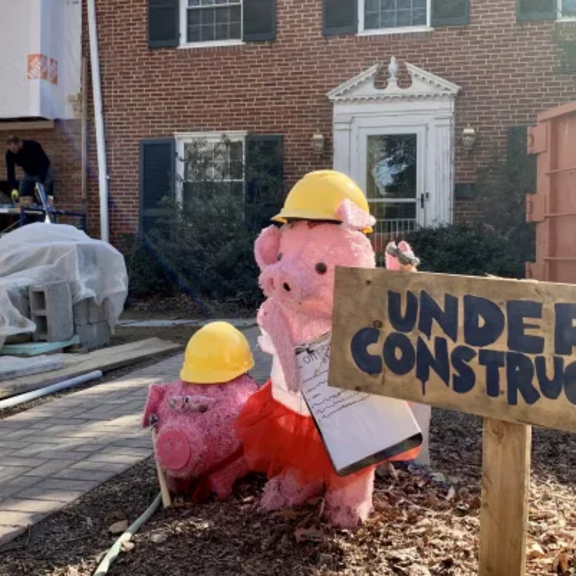 Large brick house under construction.