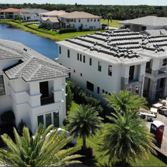 View of large houses with palm trees.