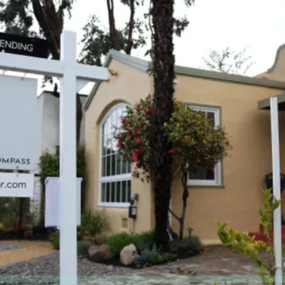 A for sale sign outside a house