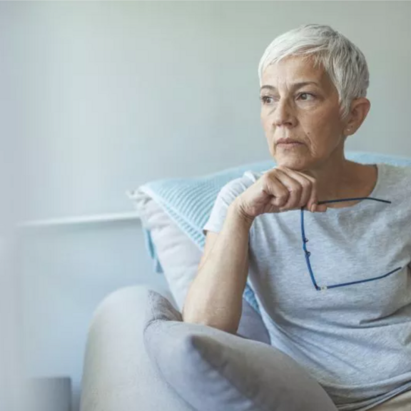 Older woman sitting on a chair