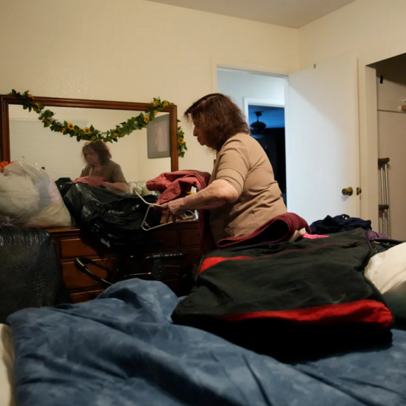 Woman unpacking suitcase 