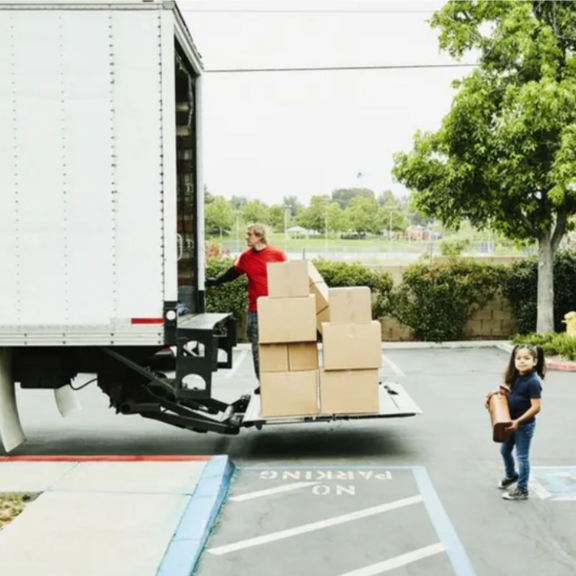 Man walking away from a moving truck