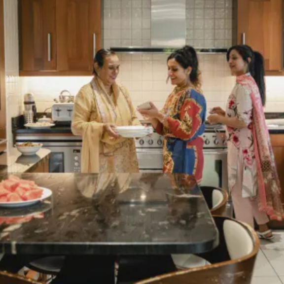 Family making food together in the kitchen