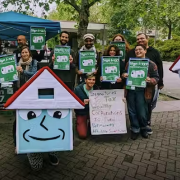 Activists gathering signatures to put Seattle social housing initiative on the ballot.