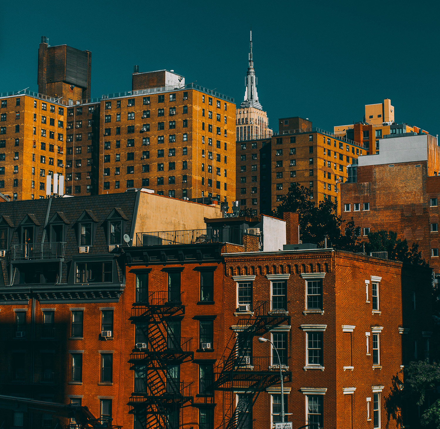 View of urban housing with high rises and townhouses.