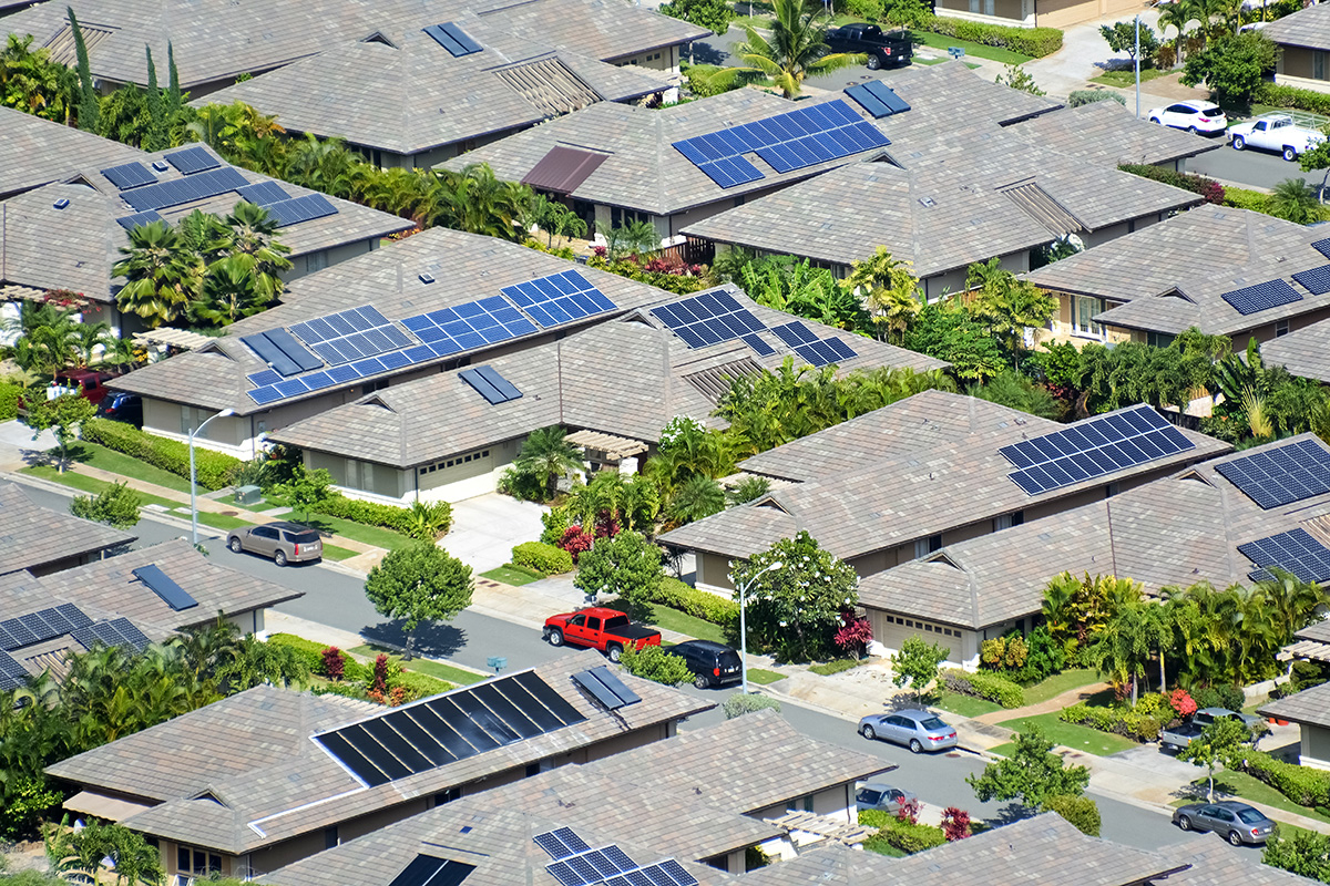 Neighborhood of ranch homes with solar panels.