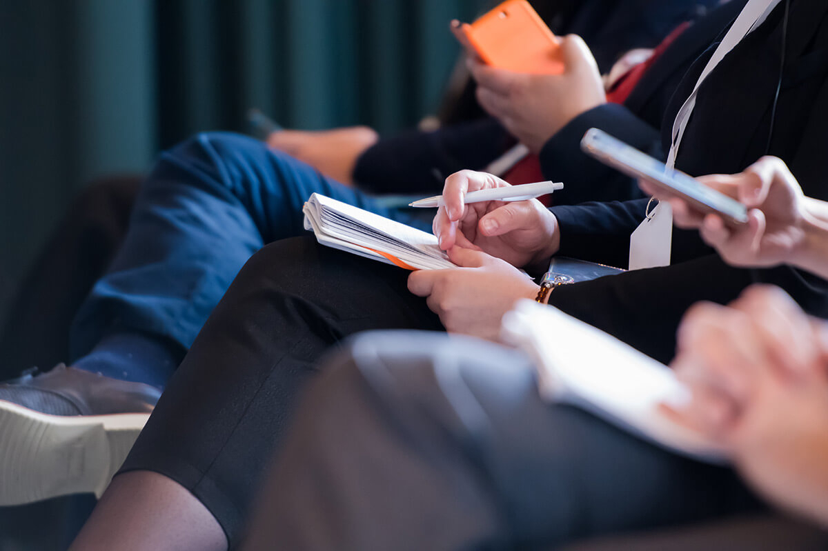 People taking notes.