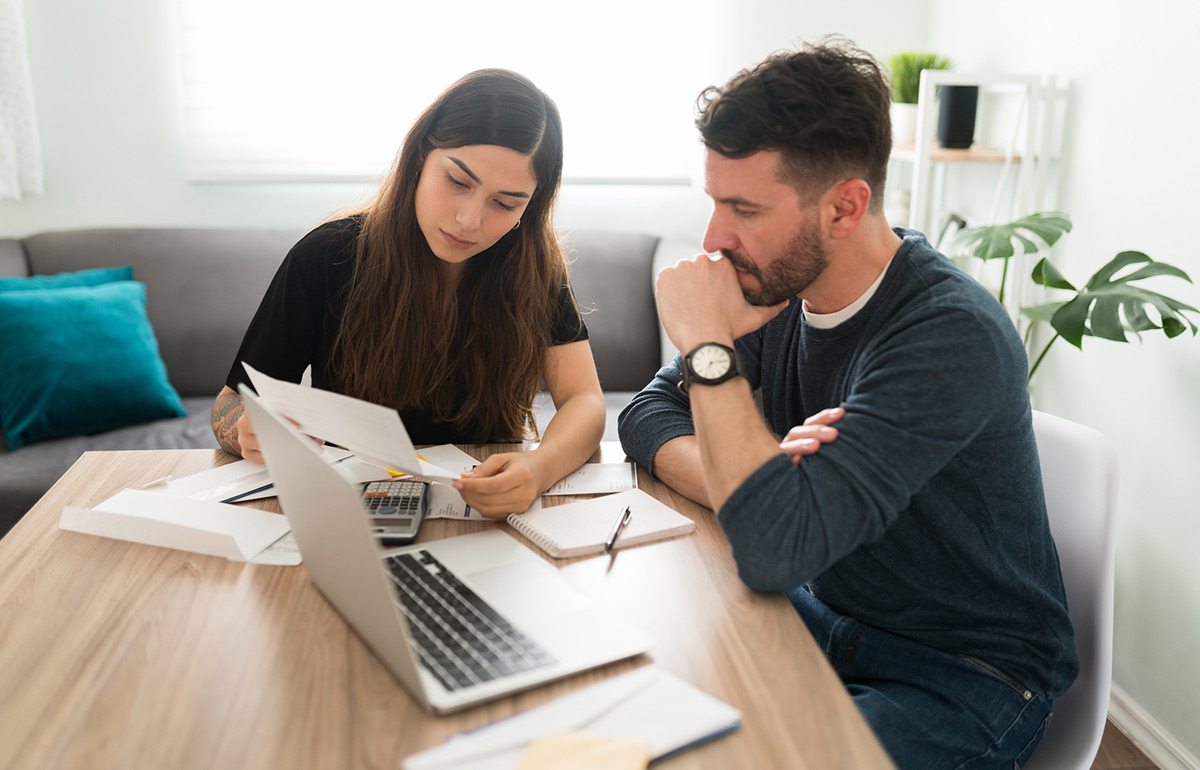 Couple looking at bills.