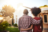 Black couple looking at a house