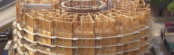 The New Carver Apartments housing under construction, showing wooden structure