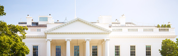 Front of the US White House on a sunny day.