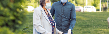 Older woman walking with young man.