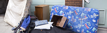 Family's belongings outside house after eviction.