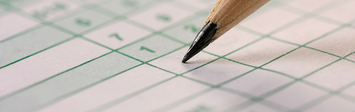 Pencil marking a scorecard.