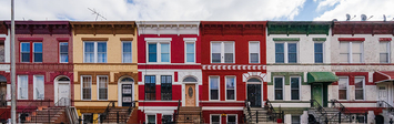 View of colorful townhouses in Brooklyn, NY.