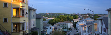 Residential street with triple decker housing.