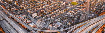 Highway interchange in Los Angeles with view of residential neighborhood.