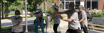 Residents at 2Life Communities performing Tai Chi.