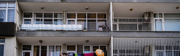 Multifamily apartment building with balconies.